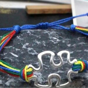 Autism Puzzle Bracelet with rainbow ties NWT